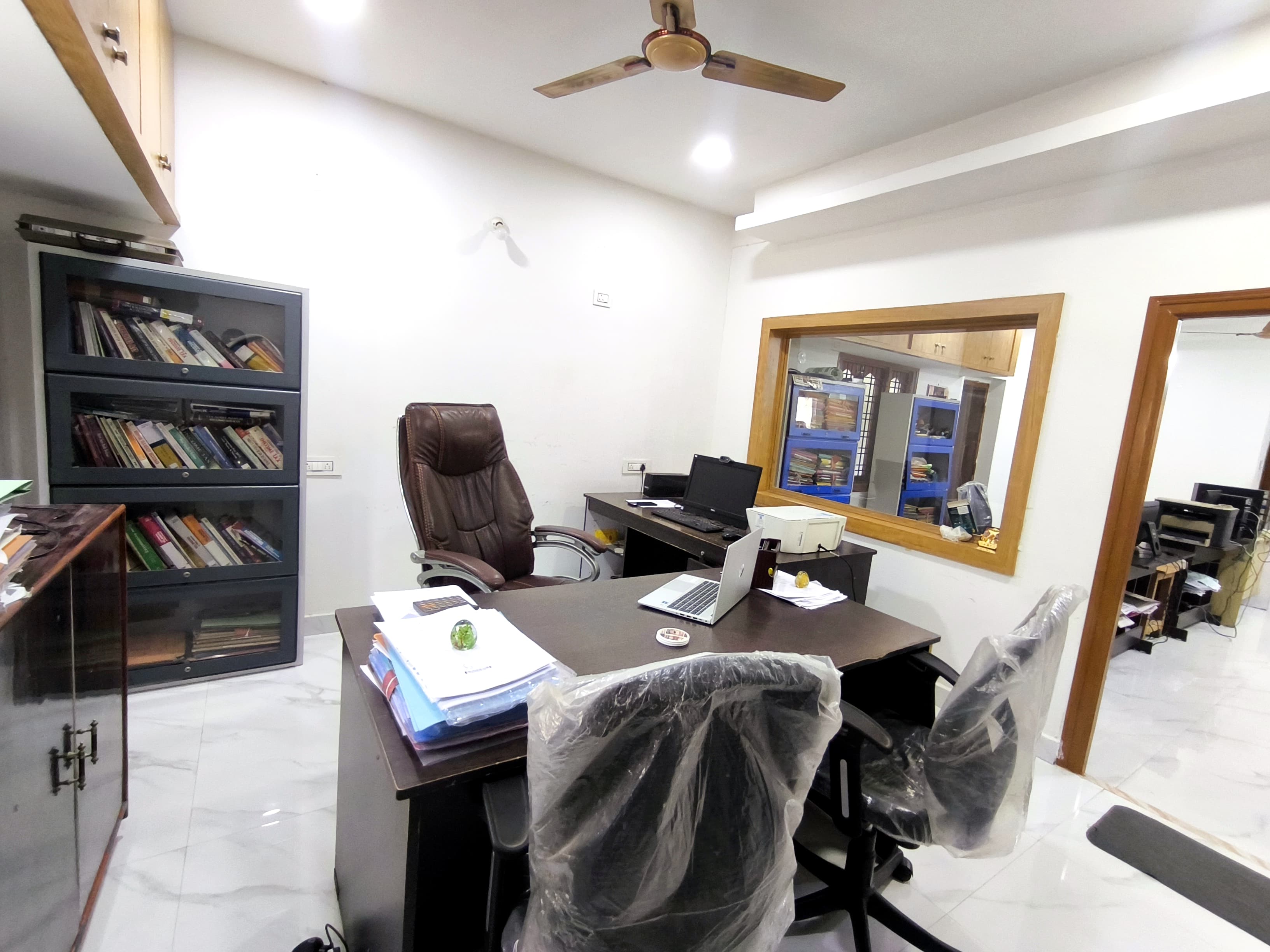 VGV Konsultancy office — consultant's desk with reference library